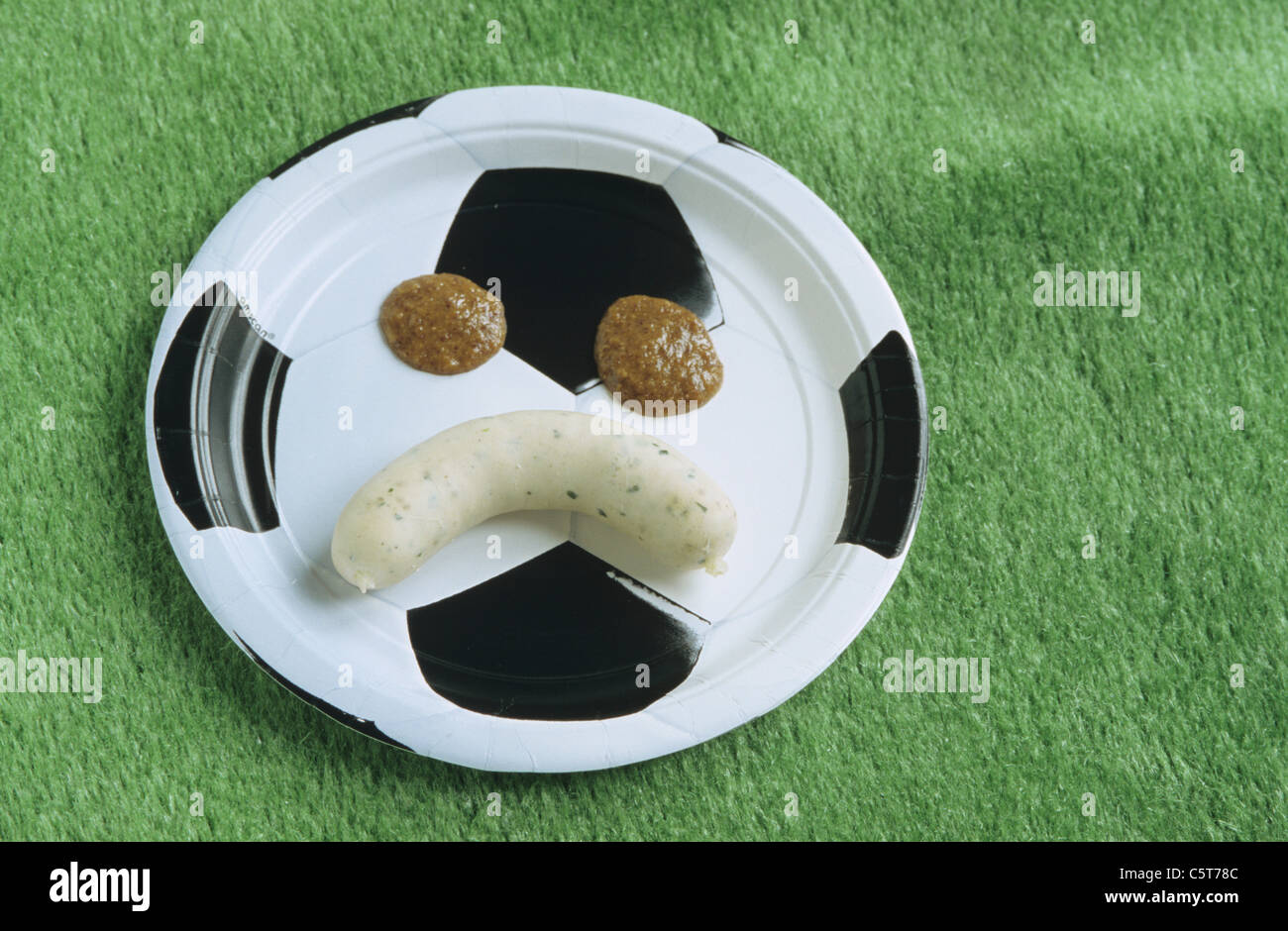 Weisswurst, white sausages on a football plate Stock Photo