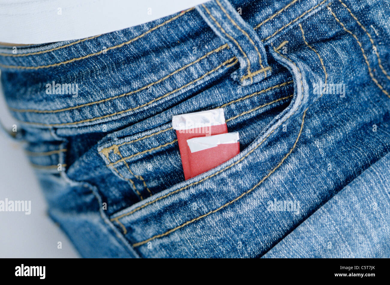 Bubble gum packets in jeans pocket Stock Photo