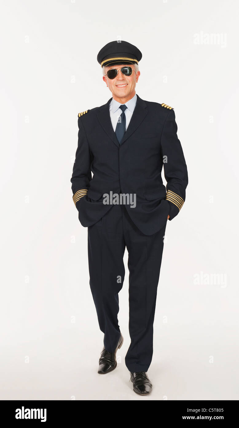 Senior flight captain against white background Stock Photo