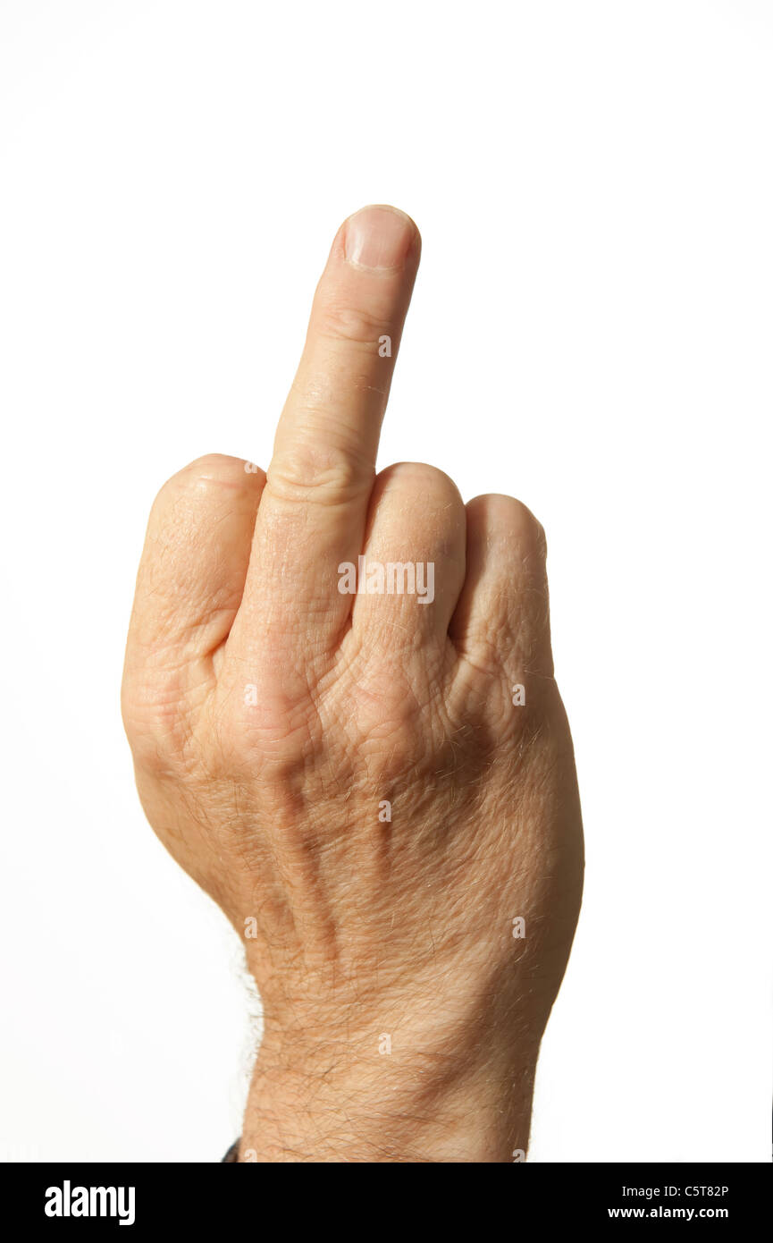 An adult human male hand giving the middle finger as an insult Stock Photo