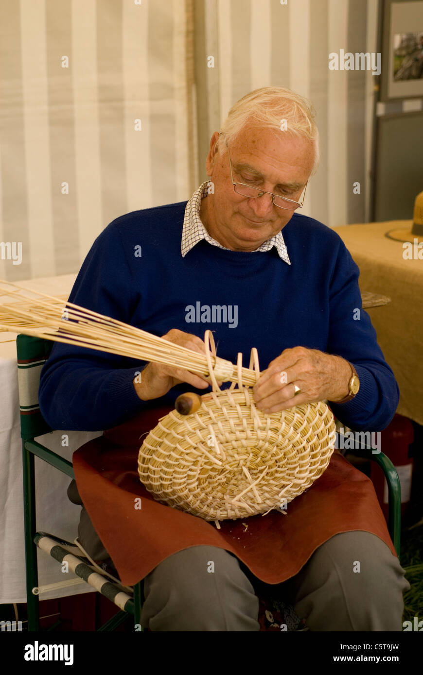 Male tradesman constructing a basket Stock Photo