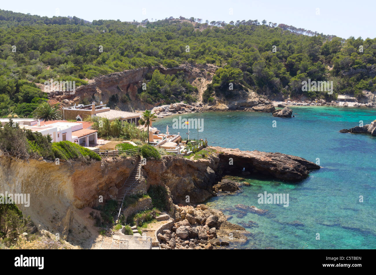 Ibiza, Balearics, Spain - Cala Xarraca, rocky inley and bay with beach, rocks and woodlands Stock Photo