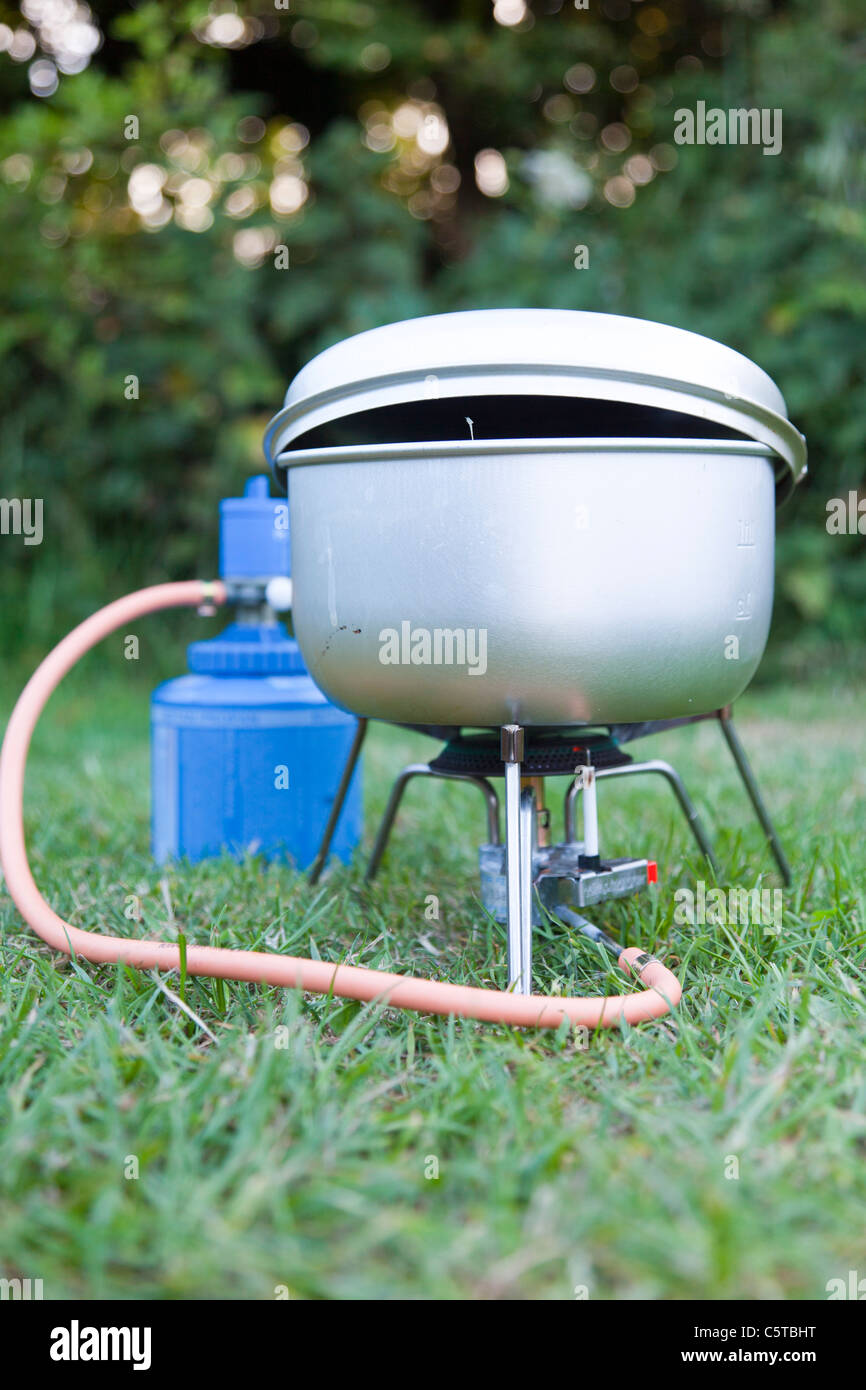 Camping gas cooker on grass Stock Photo Alamy