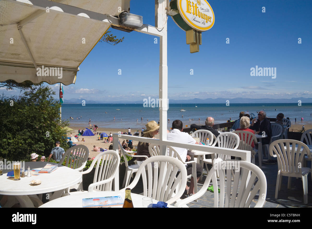 Llanbedrog Gwynedd North Wales UK July Holiday makers lunching in beach side cafe of this Welsh seaside resort on Llyn Peninsula Stock Photo