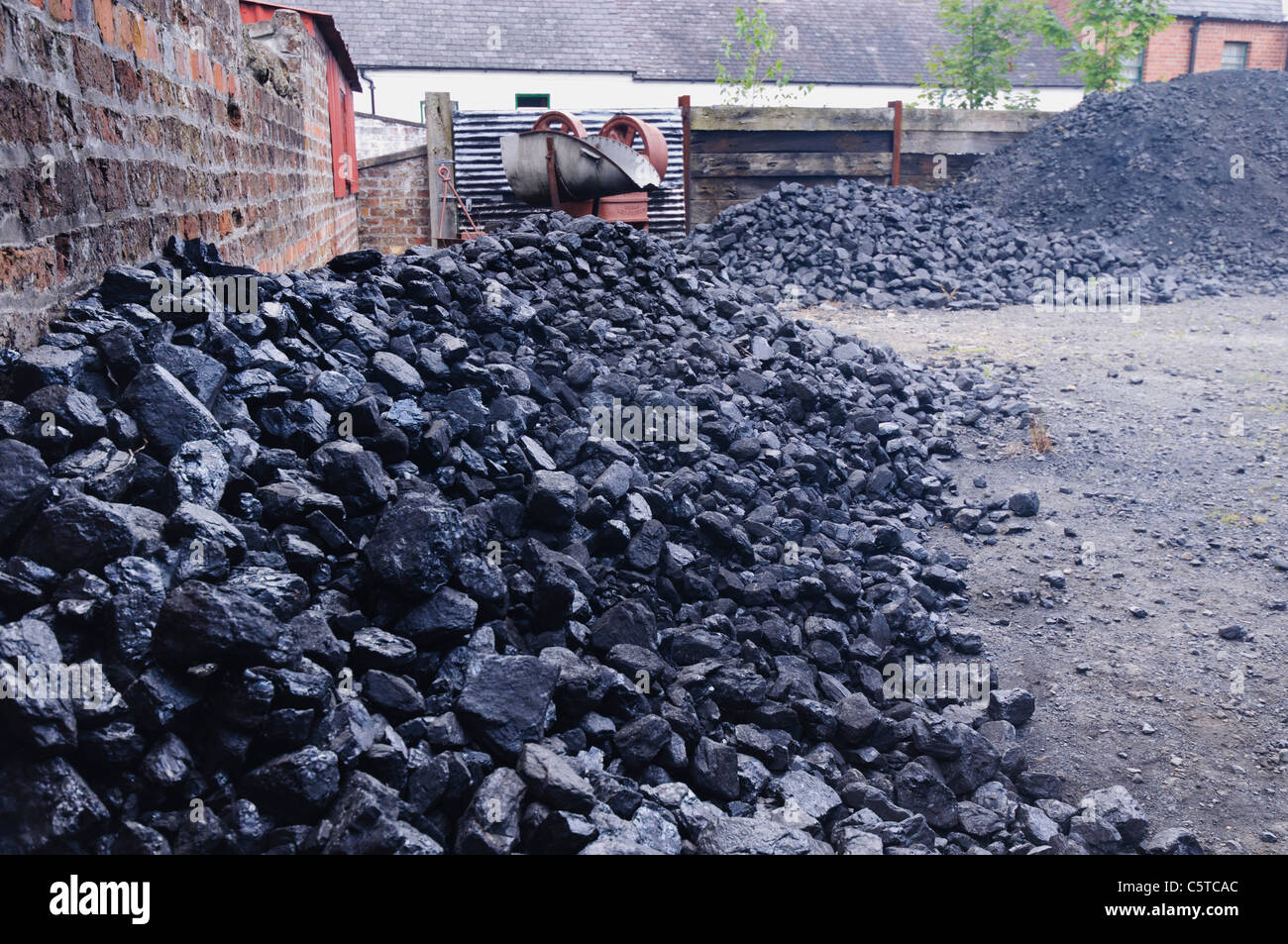 Piles of coal at a coal yard Stock Photo Alamy
