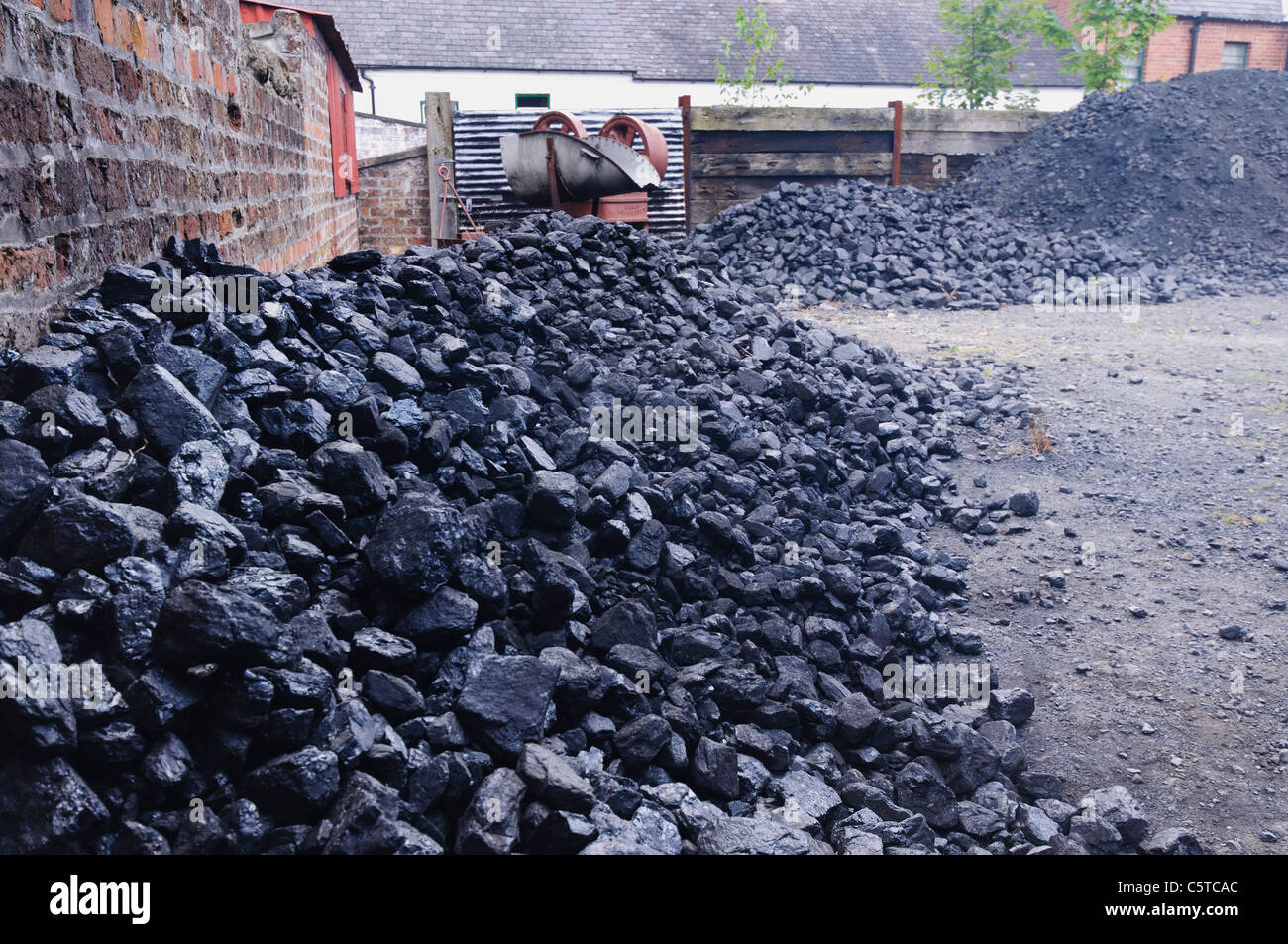 Piles of coal at a coal yard Stock Photo