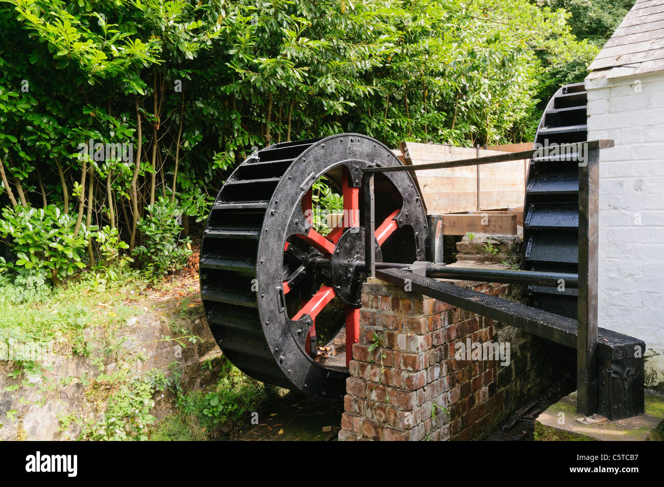 Waterwheels at a water powered Irish Mill at the Ulster Folk Park Museum Stock Photo