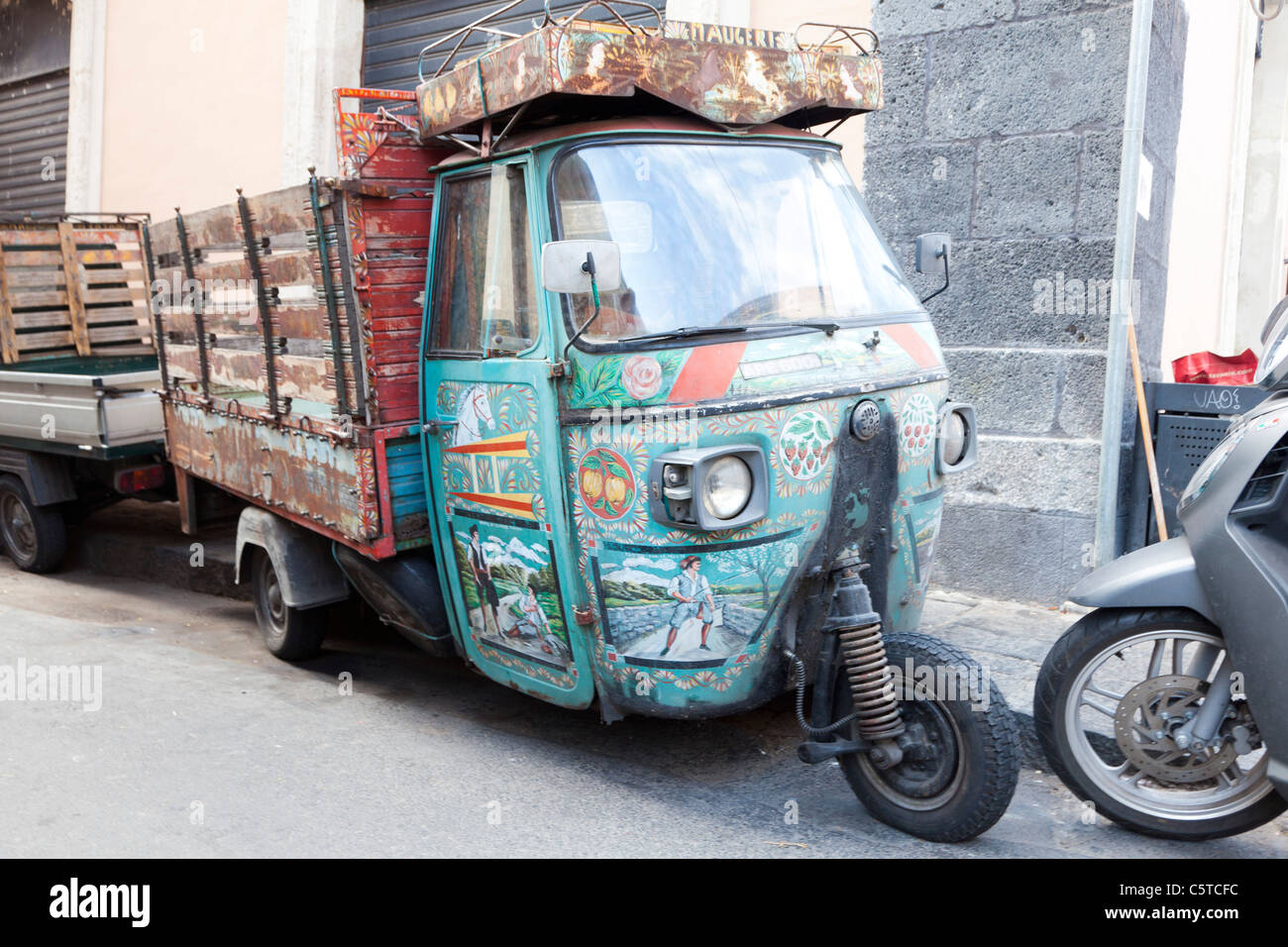 Tradionally decorated Piaggio Ape mini van in Catania Sicily Stock Photo