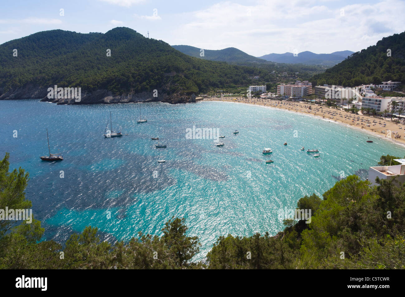 Ibiza, Balearics, Spain - Cala de San Vincente or Sant Vincent, bay with beach and hotels Stock Photo
