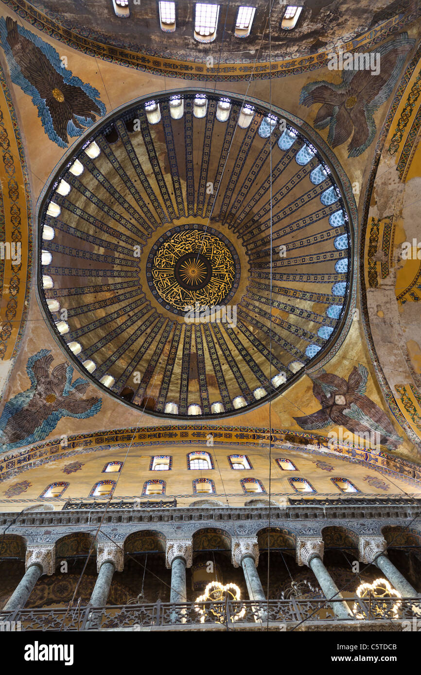 A direct view of the central dome and the side Seraphims, led by the balcony pillars from the first floor. Sophia, Istanbul. Stock Photo