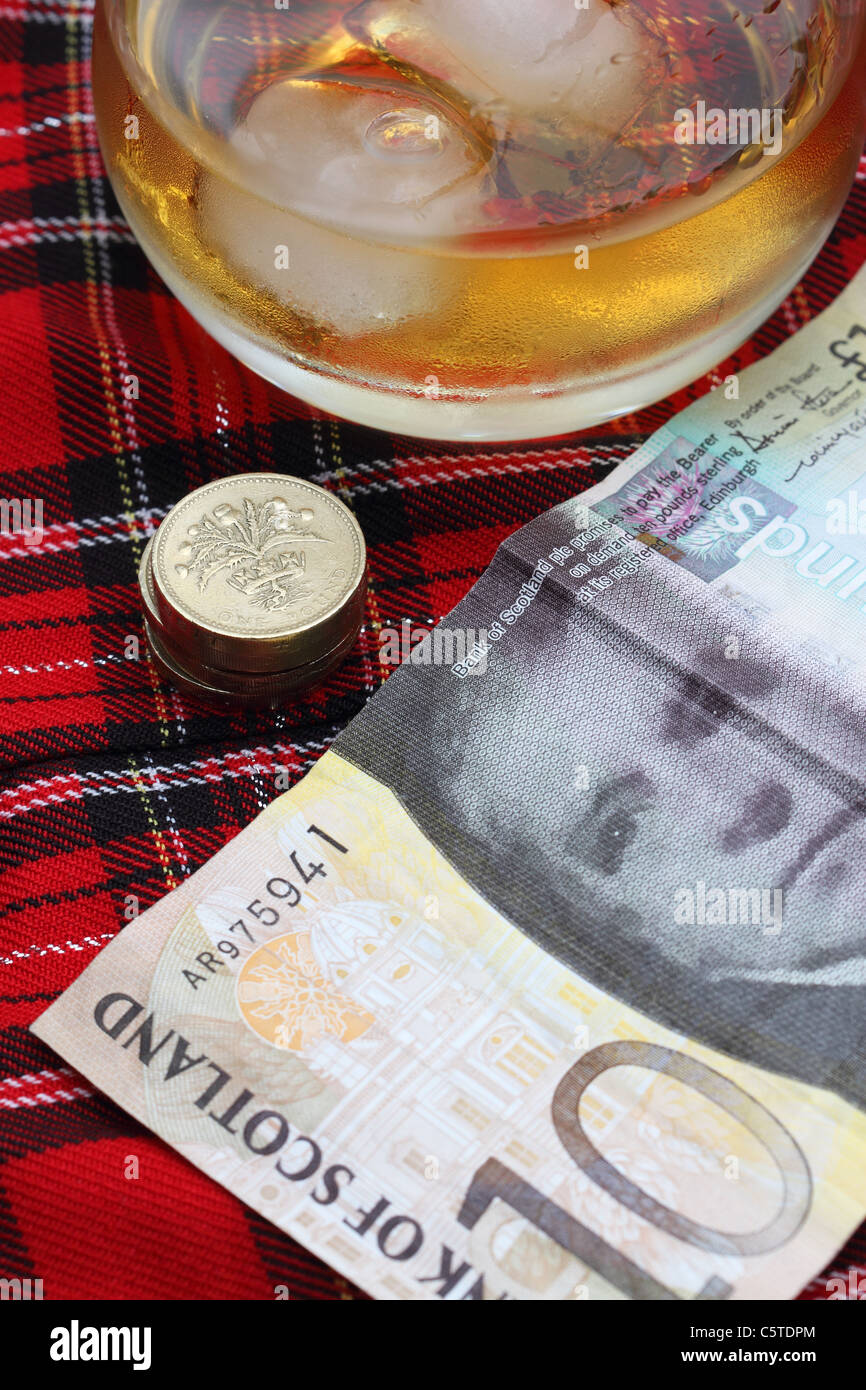 Scottish Ten Pound Note With A Background Of Tartan And Scotch Stock Photo