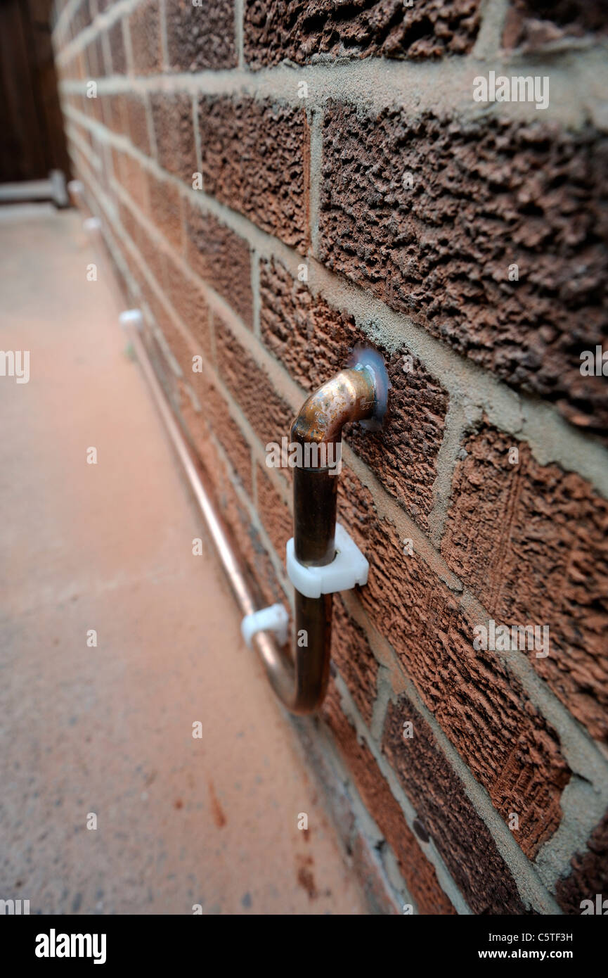 copper pipe carrying gas supply into property england uk Stock Photo
