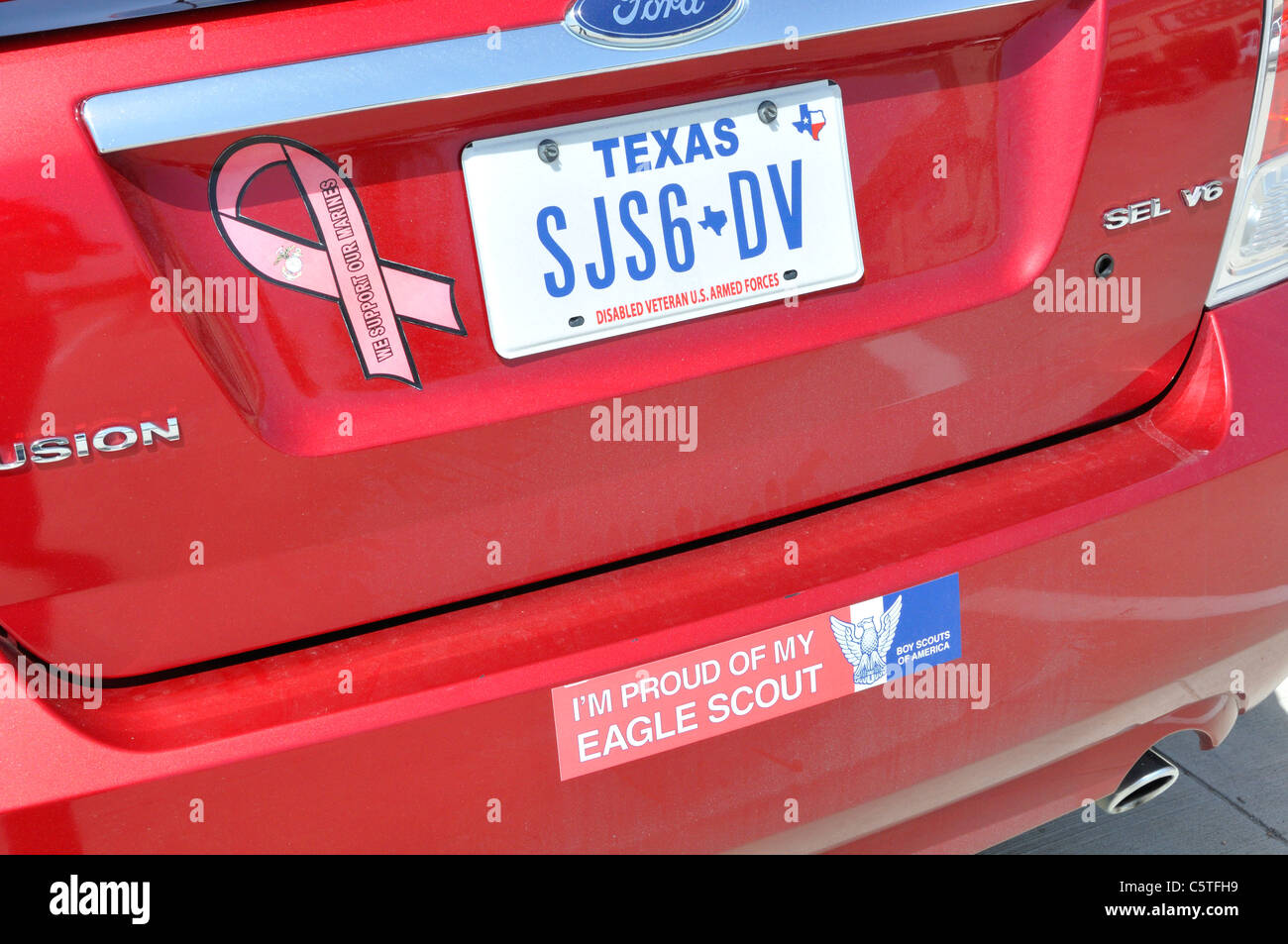 Bumper sticker saying I'M PROUD OF MY EAGLE SCOUT and Texas license plate Stock Photo