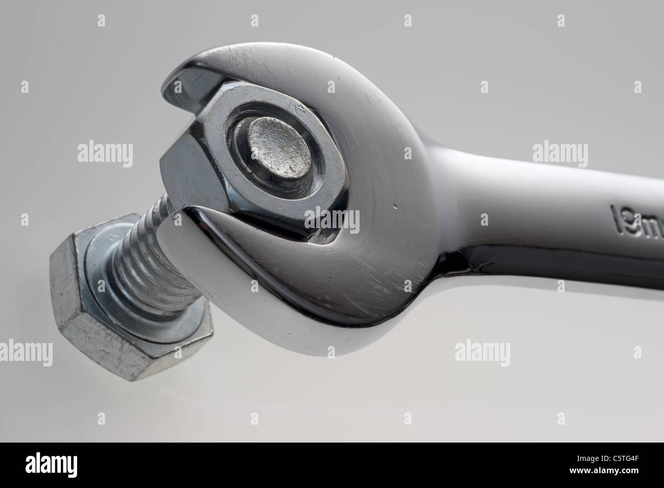 Extreme close up of a wrench, nut, and bolt Stock Photo