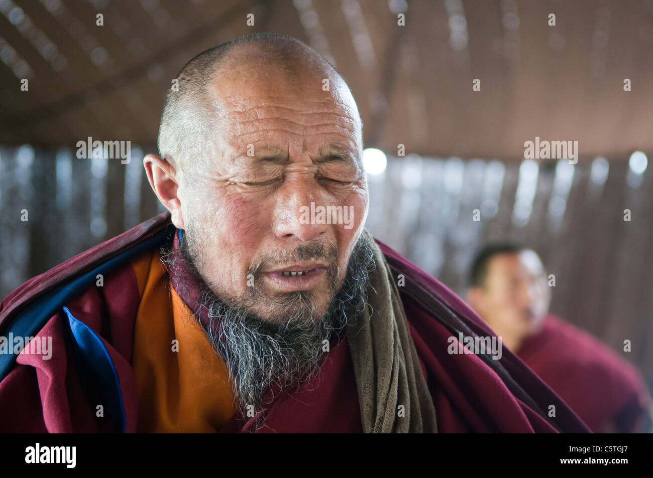 Tibetan Buddhist monk chants during tea ceremony, Arou Ba Temple