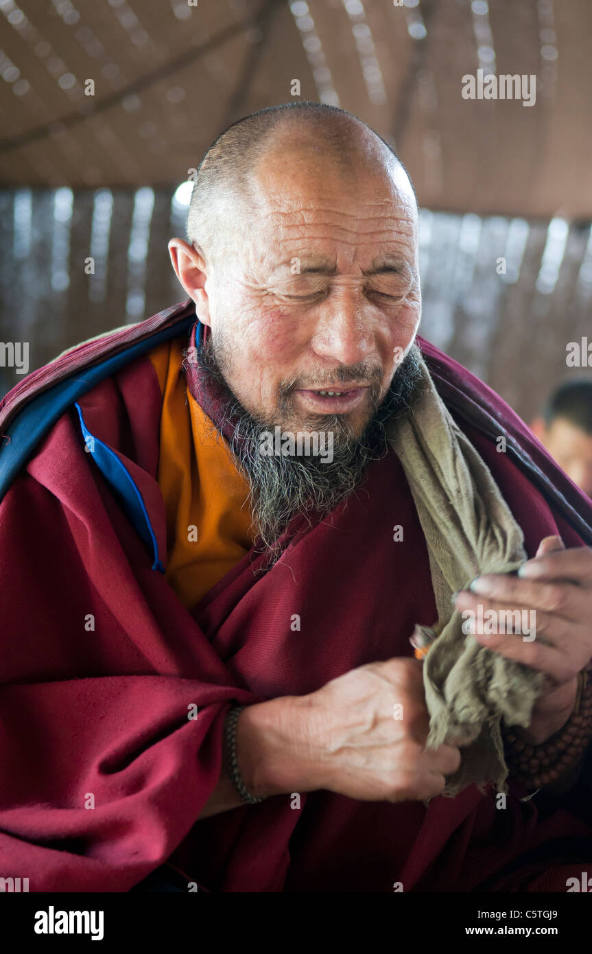 Tibetan Buddhist monk chants during tea ceremony, Arou Ba Temple