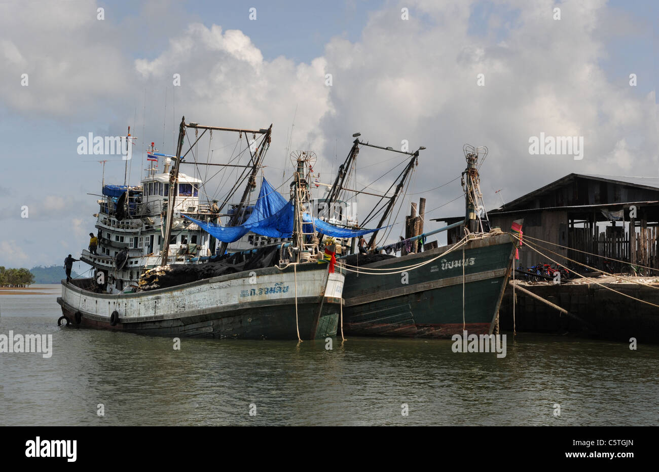 commercial fishing boats docked at Ranong Thailand Stock Photo