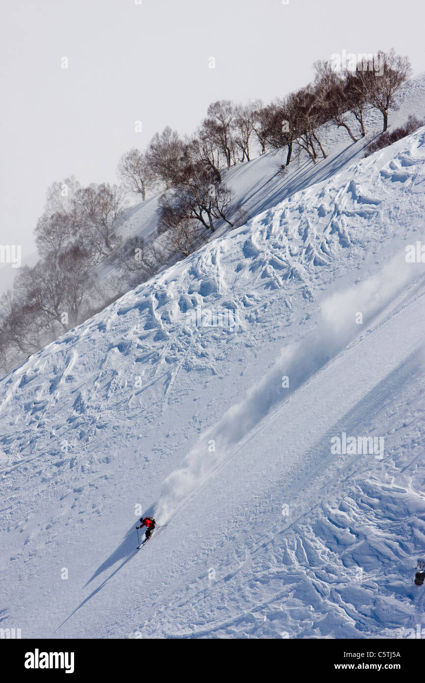 India, Kashmir, Gulmarg, Man skiing downhill Stock Photo