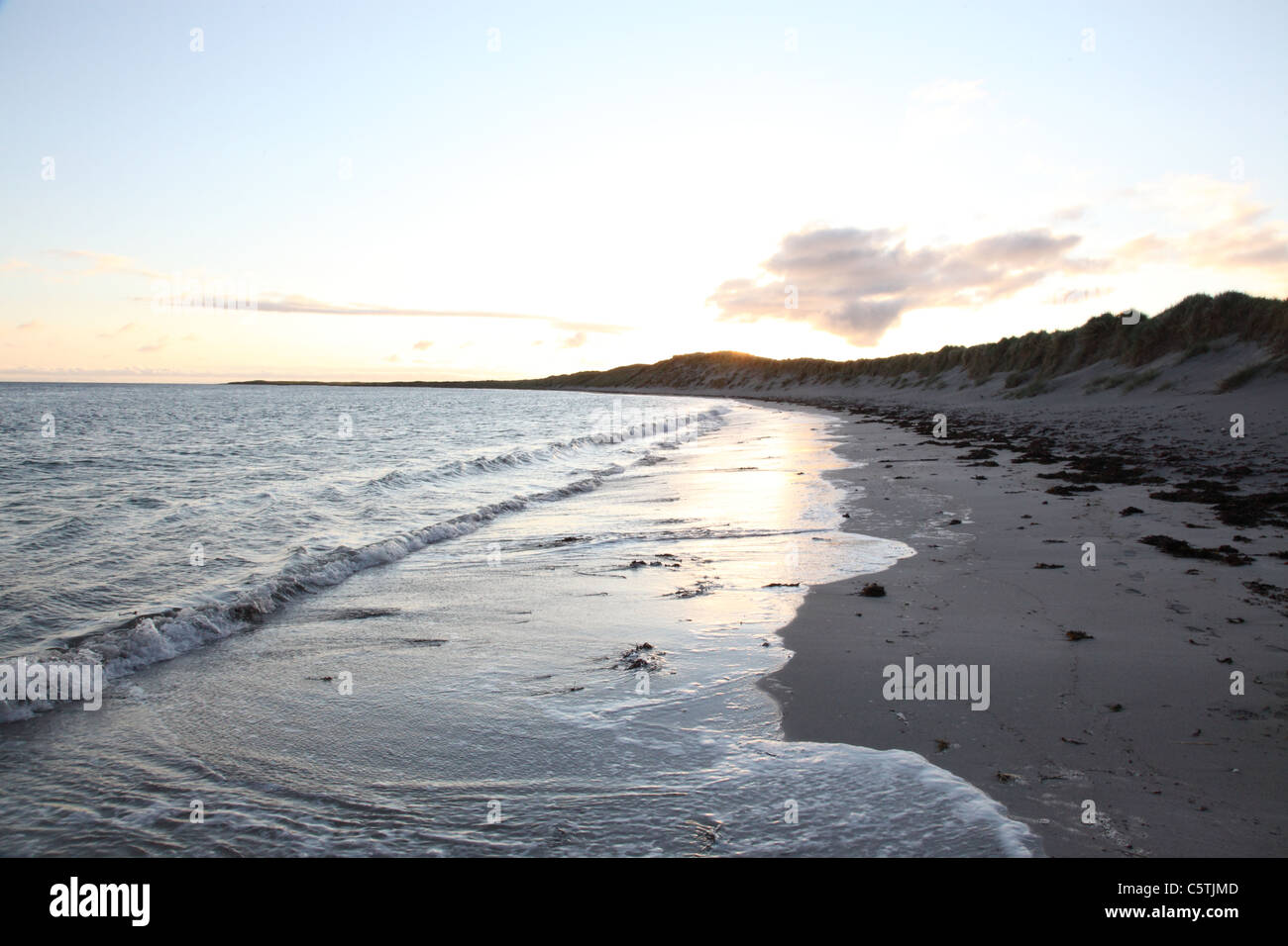 The beach at Eilean Siar, Benbecula, Outer Hebrides looking towards the mountains of South Uist Stock Photo
