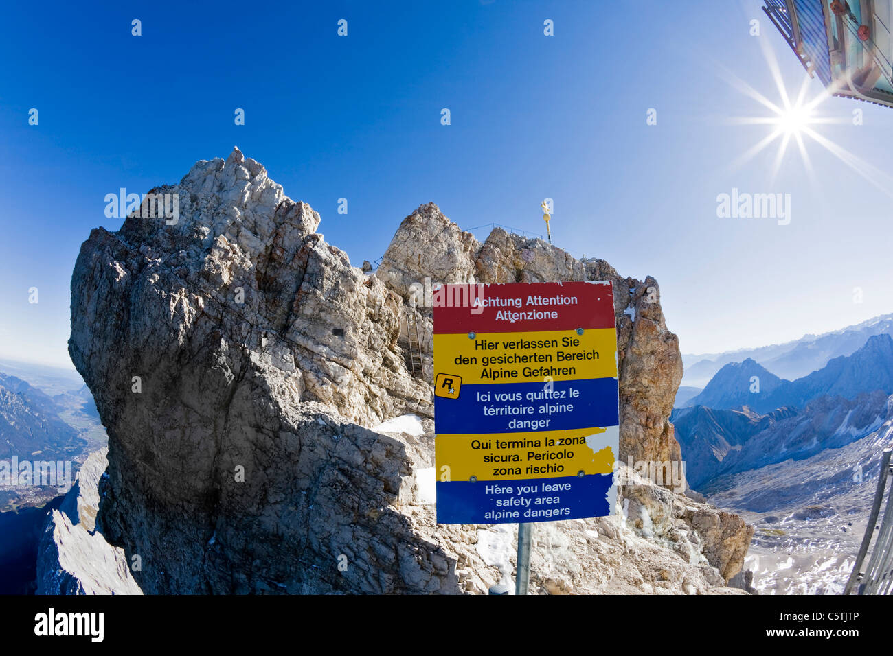 Germany, Bavaria, Wetterstein mountains, Zugspitze, Summit cross, Warning sign Stock Photo