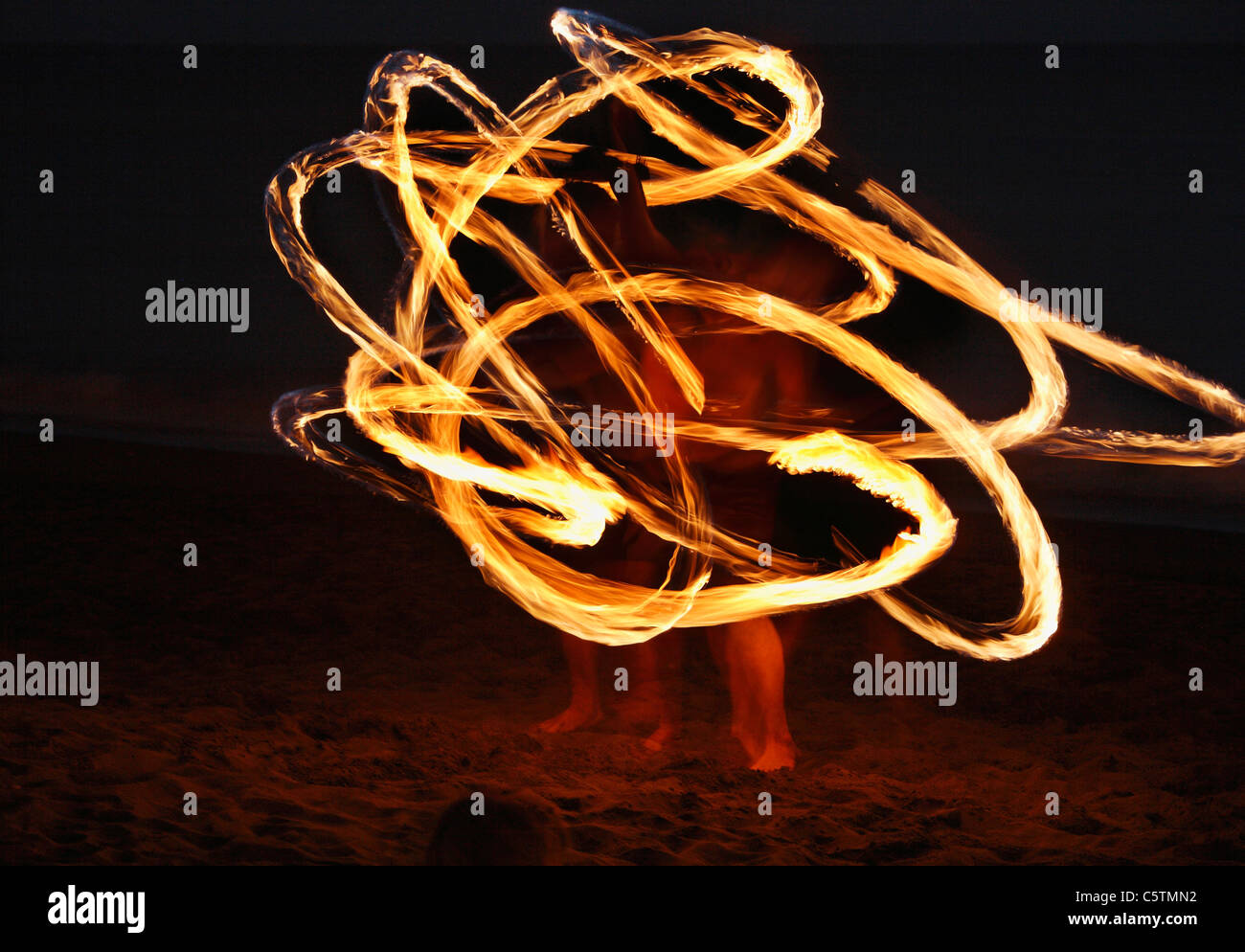 Spain, Canary Islands, La Gomera, La Playa, Valle Gran Rey, People doing torch dance on beach at evening Stock Photo