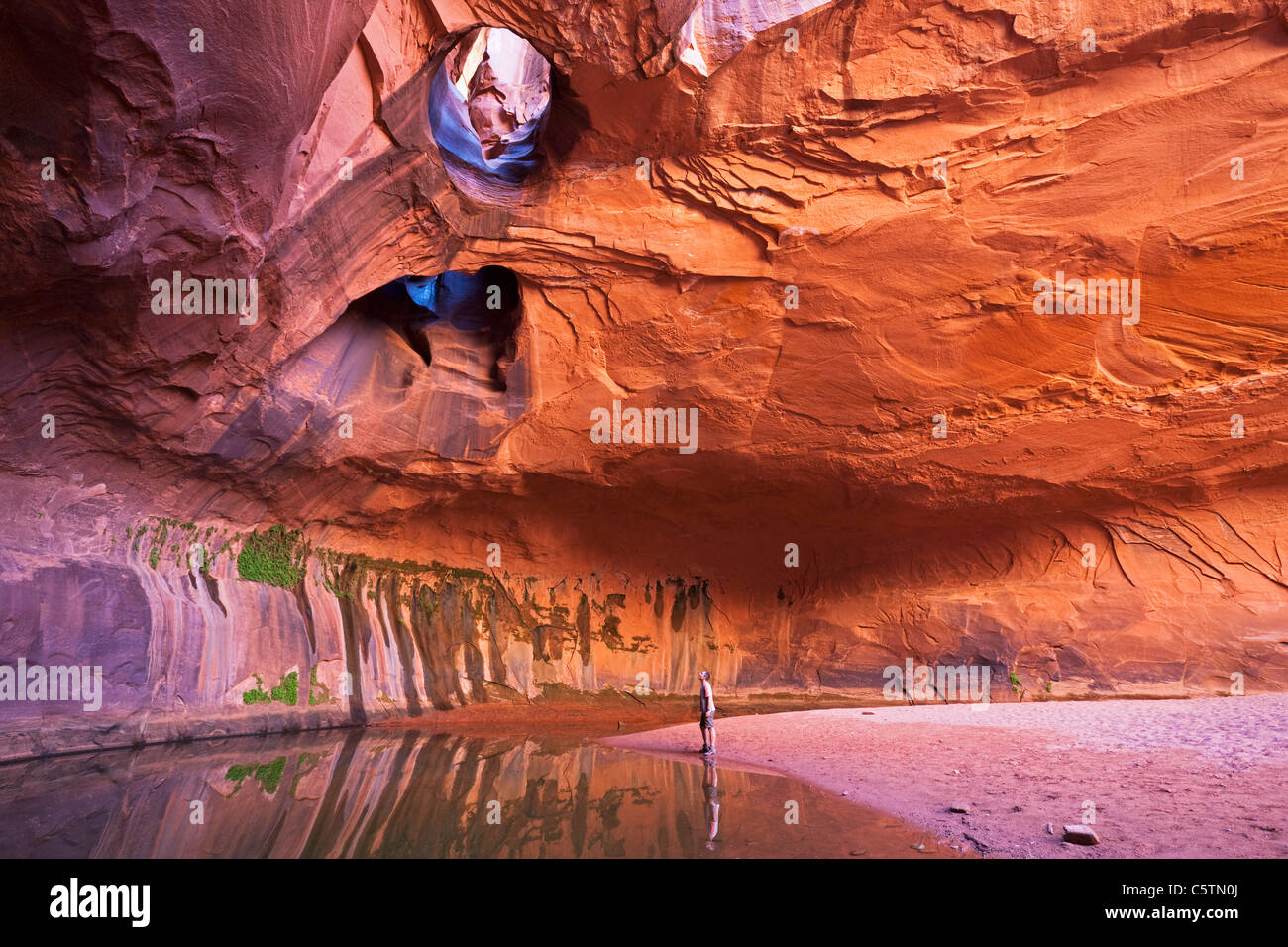 USA, Utah, Grand Staircase-Escalante National Monument, Neon Canyon, Tourist in Golden Cathedral Stock Photo
