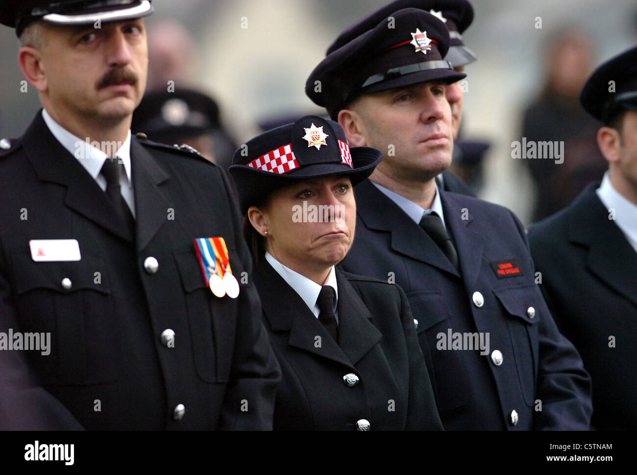 Tears for a colleague , fire brigade members show their emotions at the funeral of firefighter Brian Wembridge in Crowborough Stock Photo