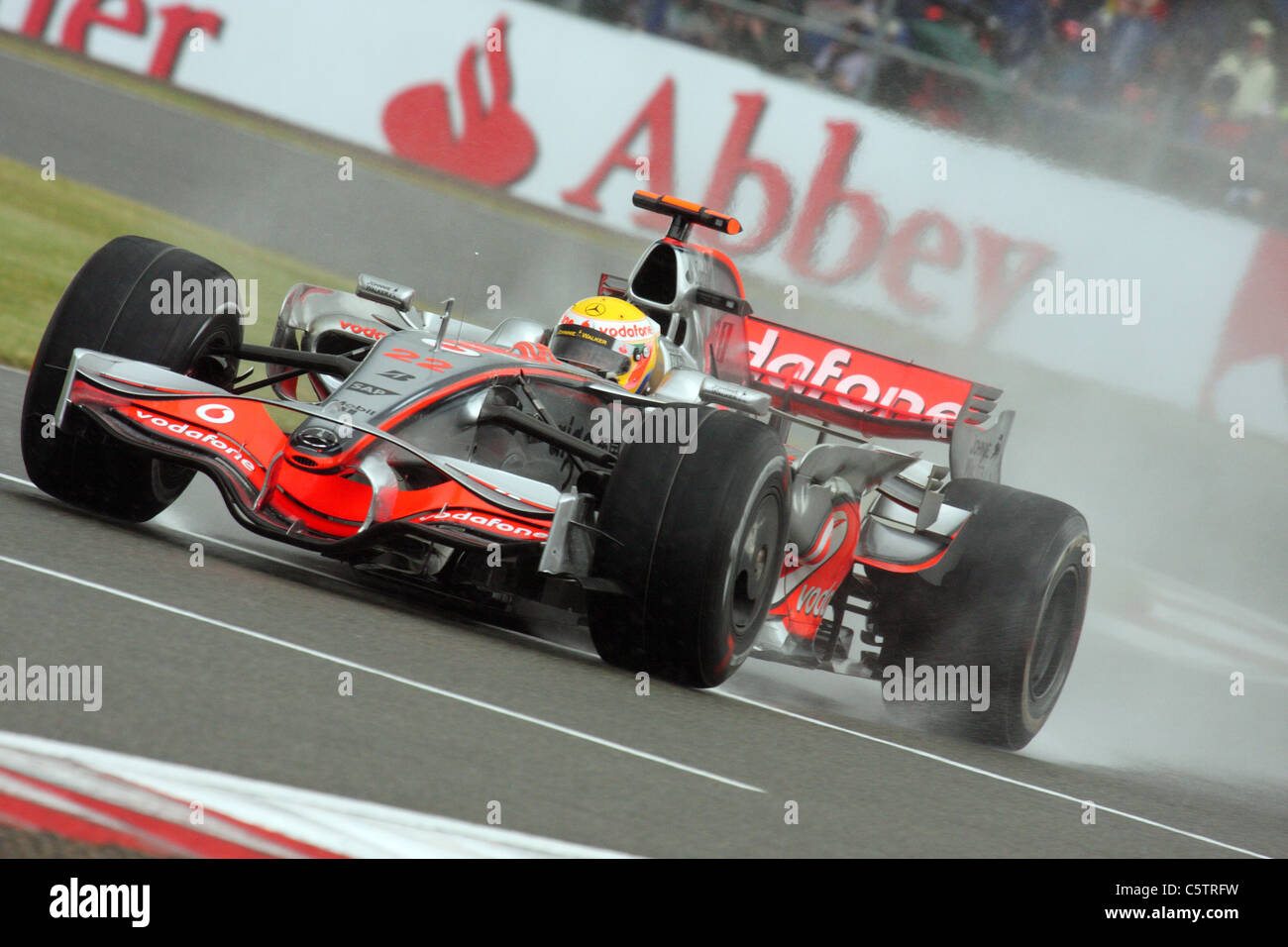 Lewis Hamilton battles with the rain at Silverstone Stock Photo