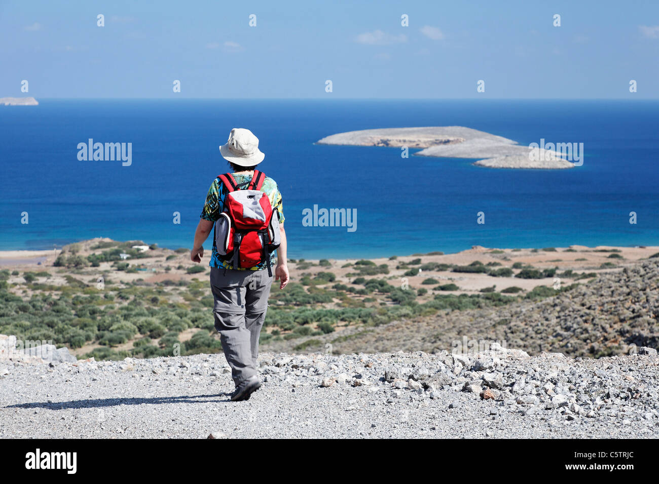 Greece, Crete, Palekastro, Mature woman hiking near sea Stock Photo