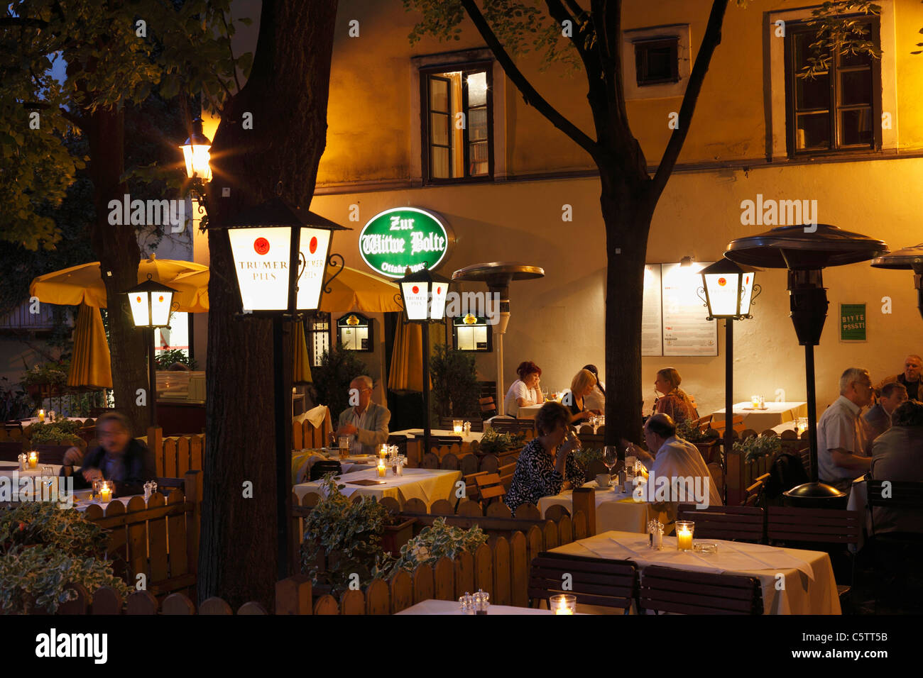 Austria, Vienna, Salzkammergut, People in restaurant at night Stock Photo