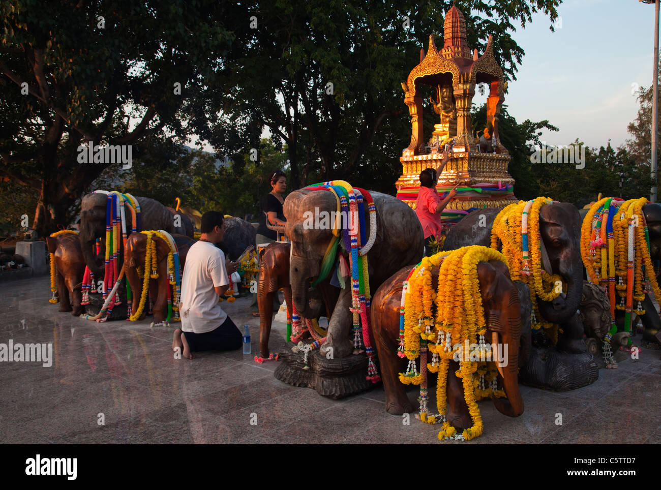 Worshippers praying at Thai Buddhist temple dedicated to elephants at Cape Promthep. Stock Photo