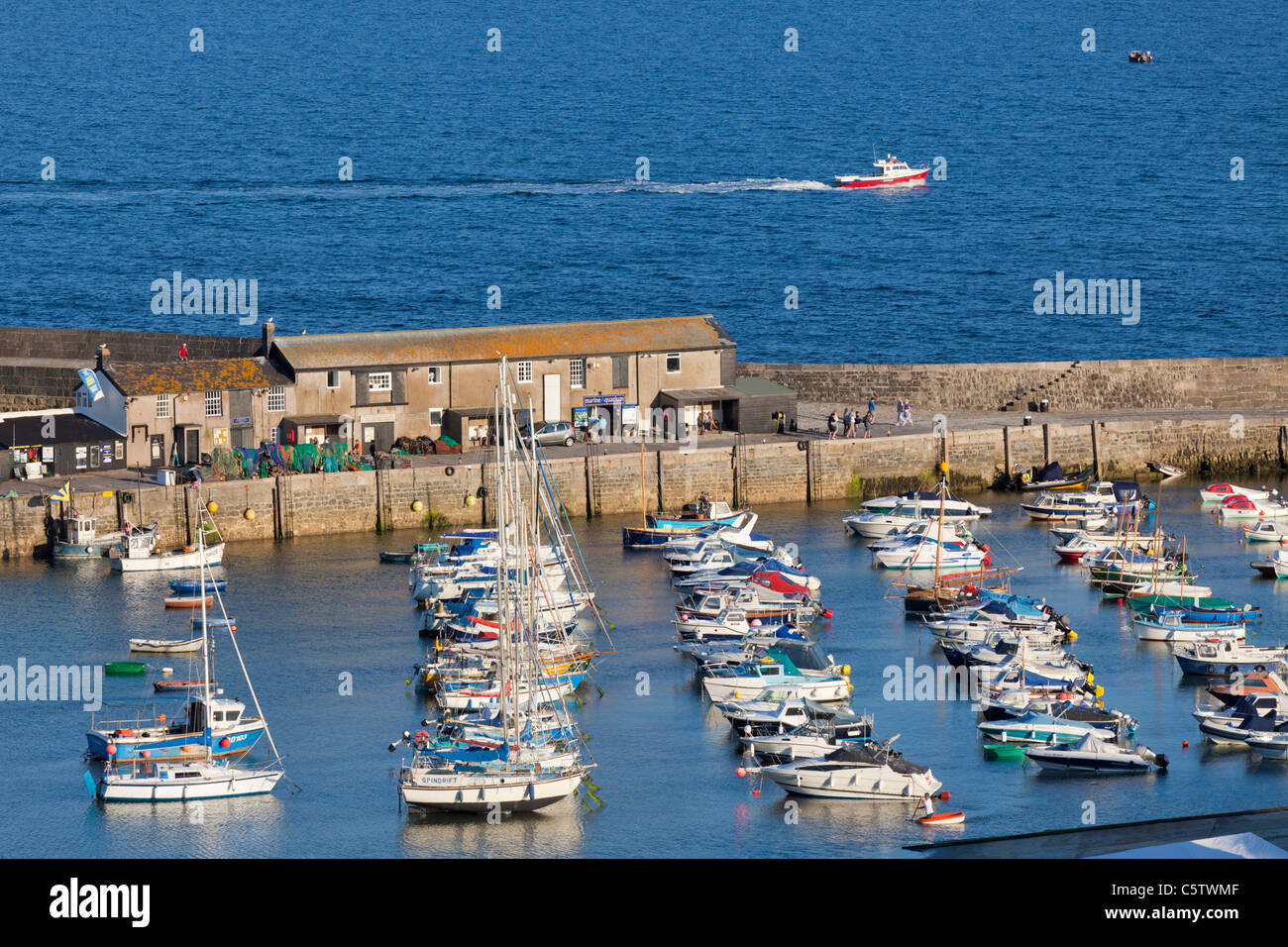 Many fishing boats in Lyme Regis harbour Dorset England UK GB EU Europe Stock Photo