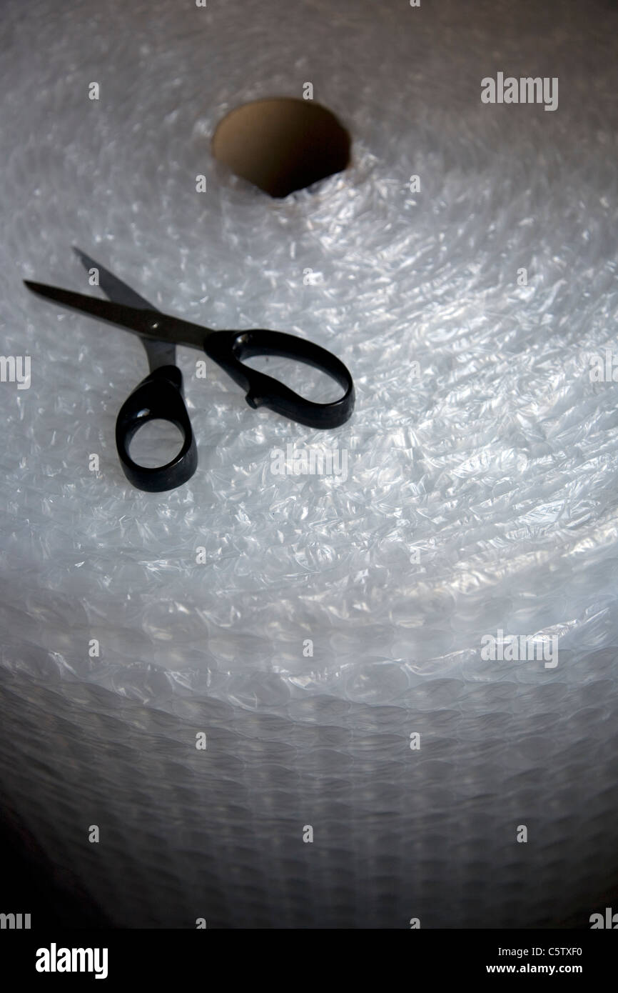 Large roll Bubble Wrap with scissors Stock Photo Alamy