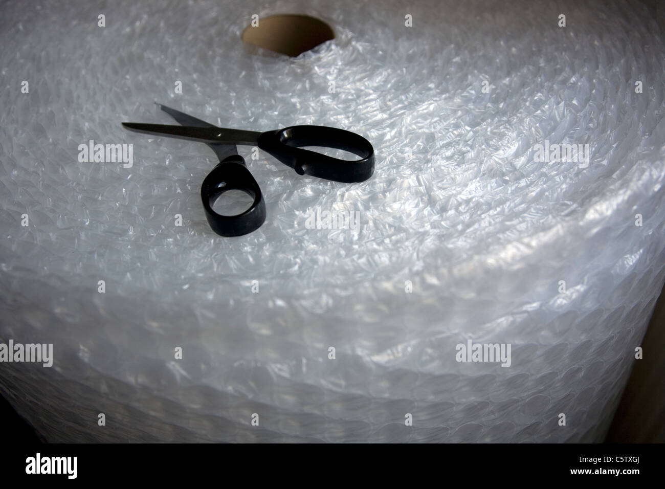 Large roll Bubble Wrap with scissors Stock Photo Alamy