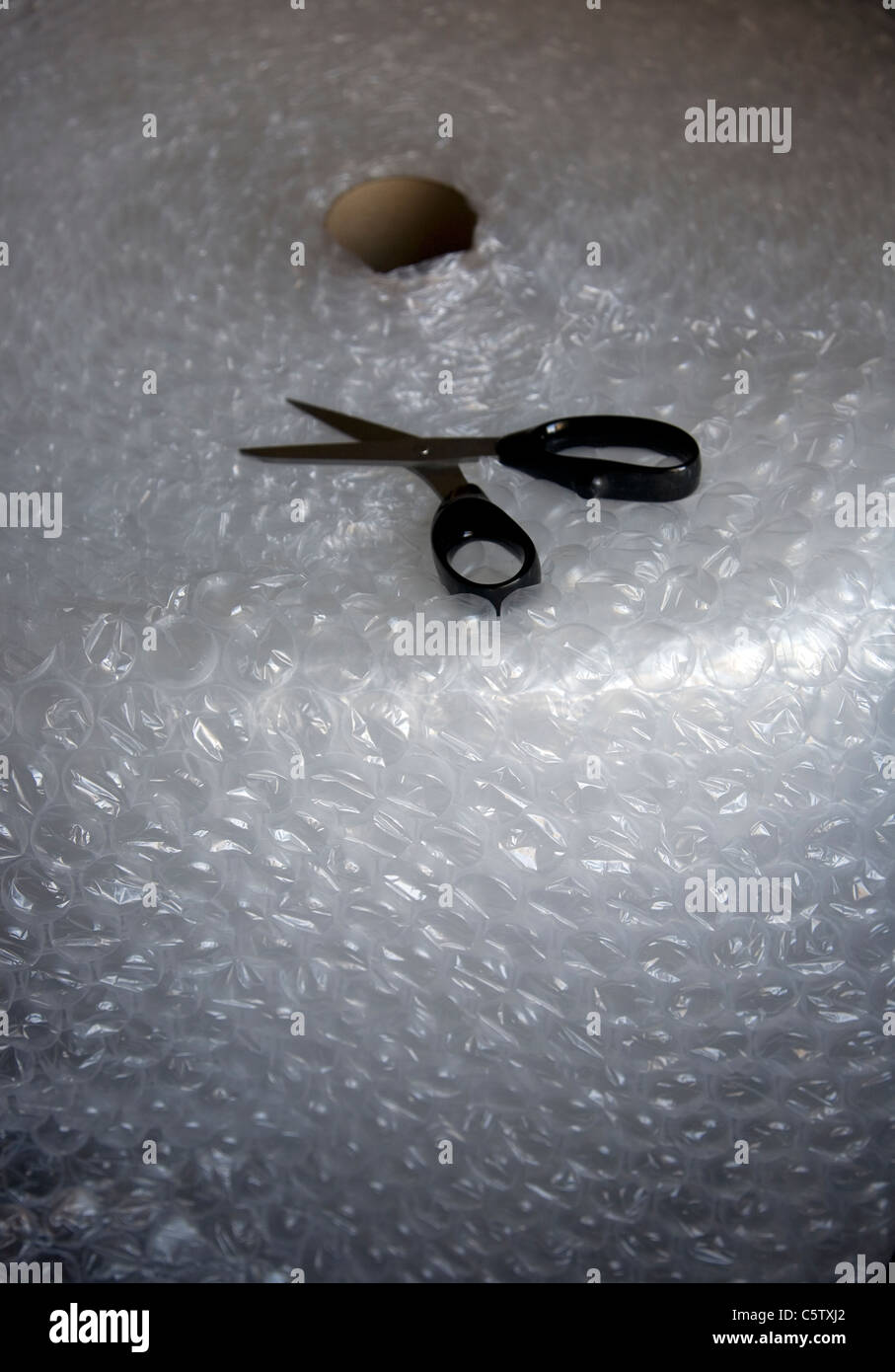 Large roll Bubble Wrap with scissors Stock Photo Alamy