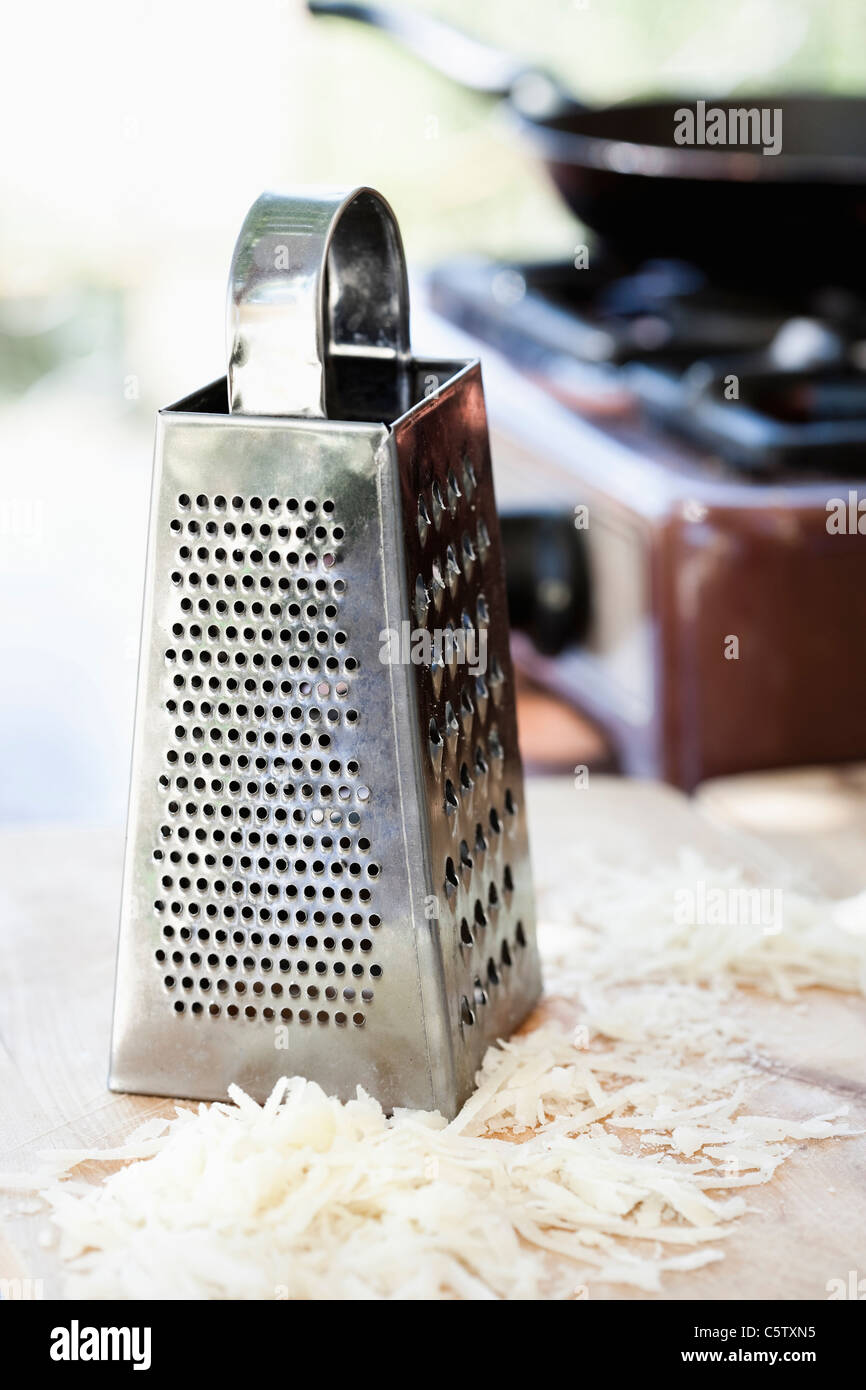 Grated cheese and grater Stock Photo