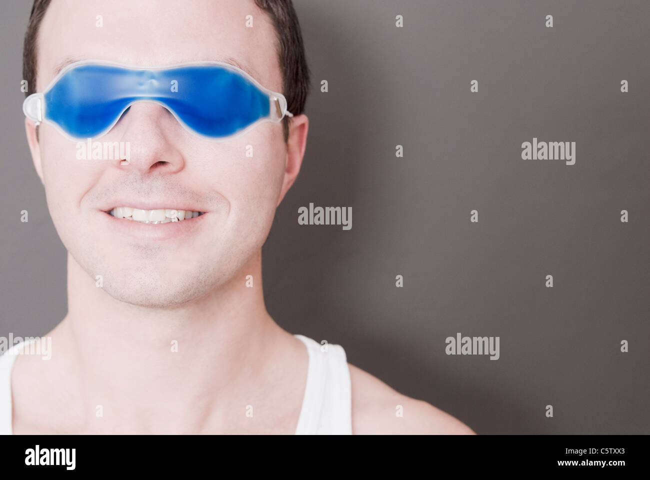 Man wearing eye mask, portrait, closeup Stock Photo Alamy
