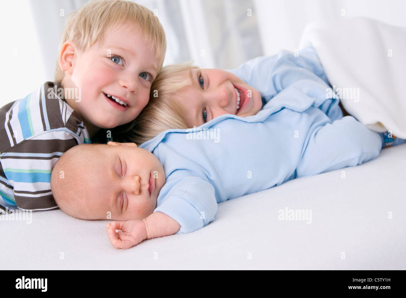 Baby girl (2 months), boy (2-3 years) and boy (4-5 years), portrait Stock Photo
