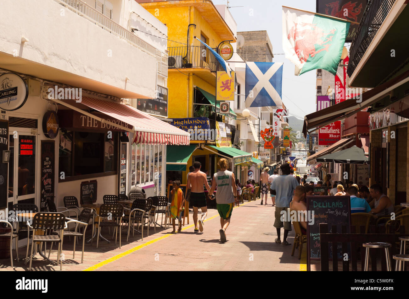 San Antonio or Sant Antoni de Portmany. Street in the central part of town  near the harbour and beach. With Scottish saltire Stock Photo - Alamy