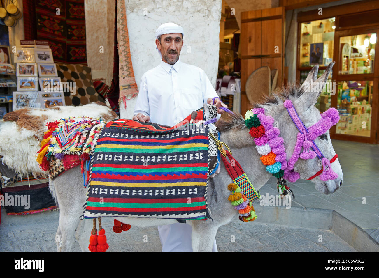 man decorated donkey souk waqif doha qatar Stock Photo