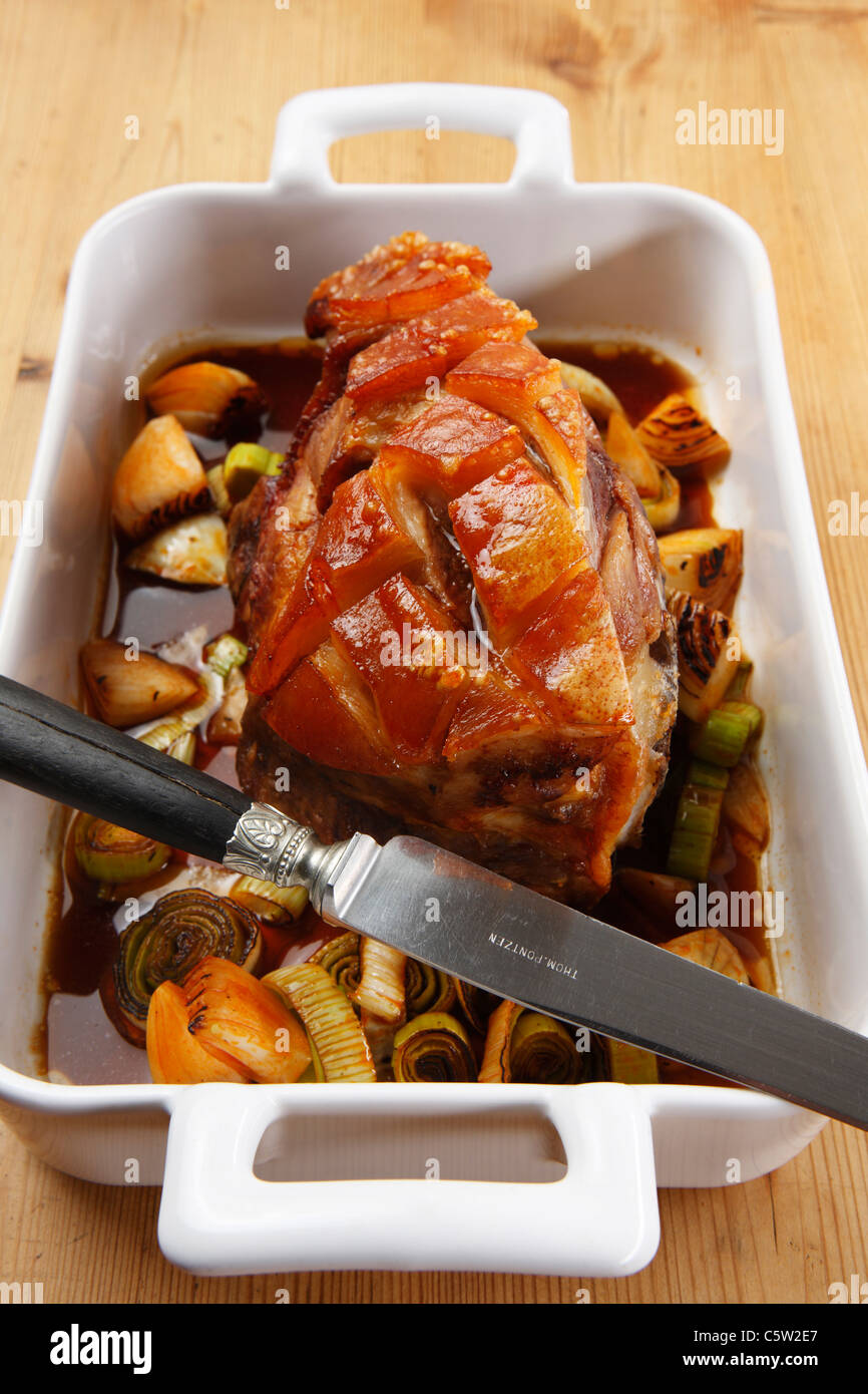 Roast Pork with Crackling in roasting tin, elevated view Stock Photo