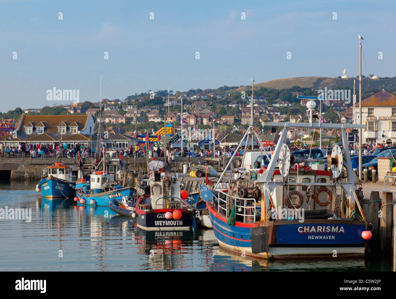 Fishing boats in busy Bridport harbour Dorset Jurassic coast England UK GB EU Europe Stock Photo