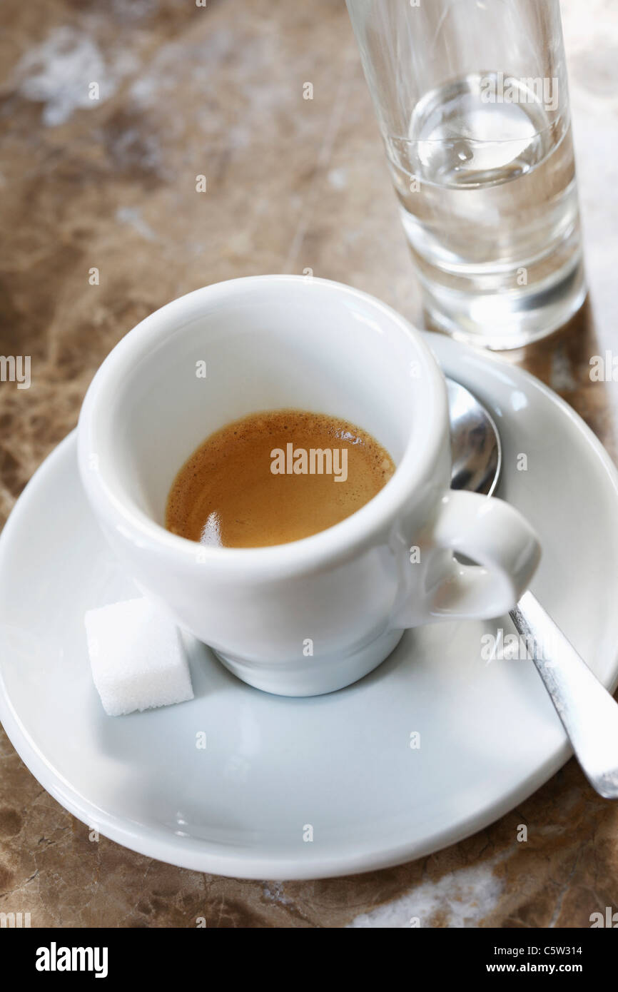 Cup of Espresso and a glass of grappa, elevated view Stock Photo