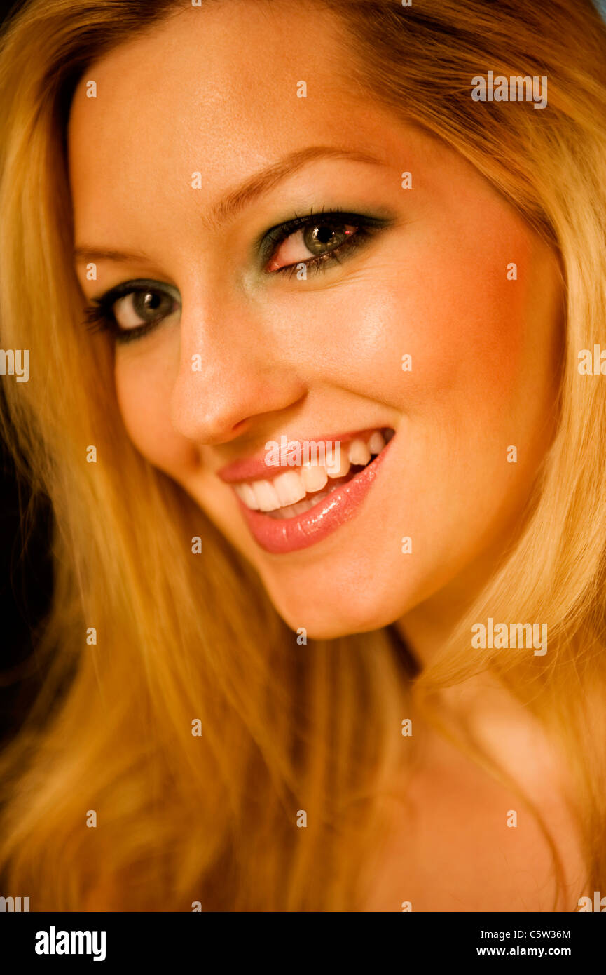 Young woman smiling, portrait Stock Photo - Alamy