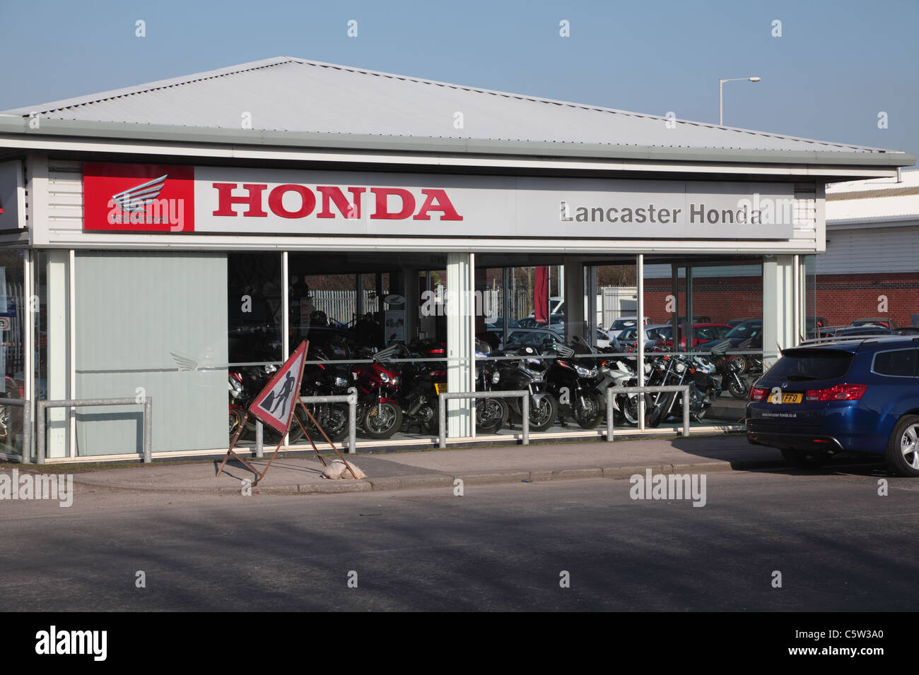 Motorcar and bike dealership on trading estate Stock Photo Alamy