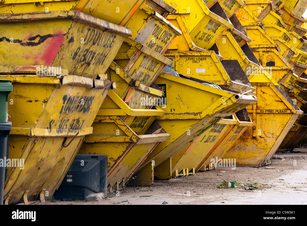 Yellow Creekside skips, Deptford creek - London Stock Photo