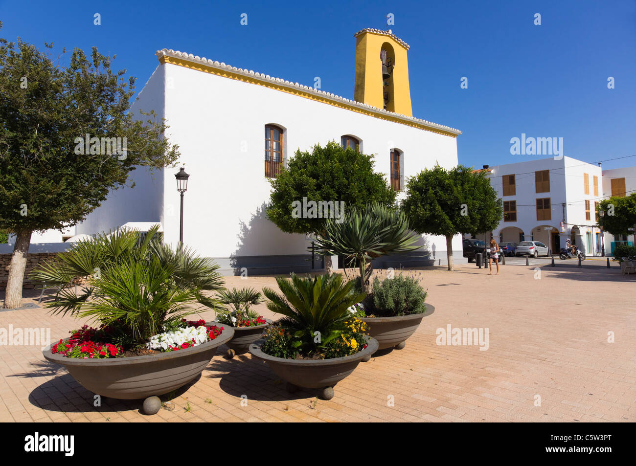 Ibiza, Balearics, Spain - the central, inland town of Santa Gertrudis. The whitewashed church in a square with orange trees. Stock Photo