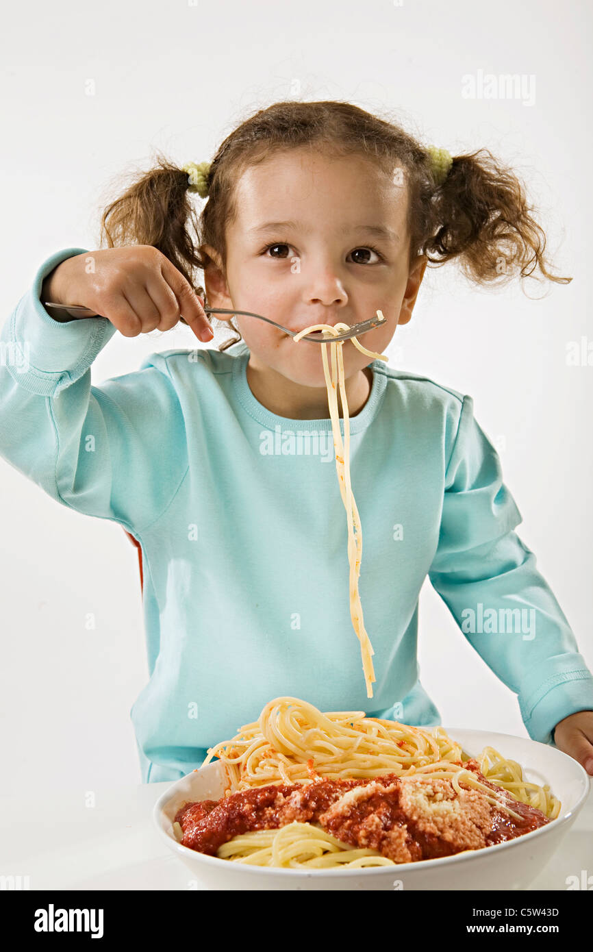 Girl (23) eating spaghetti Stock Photo Alamy