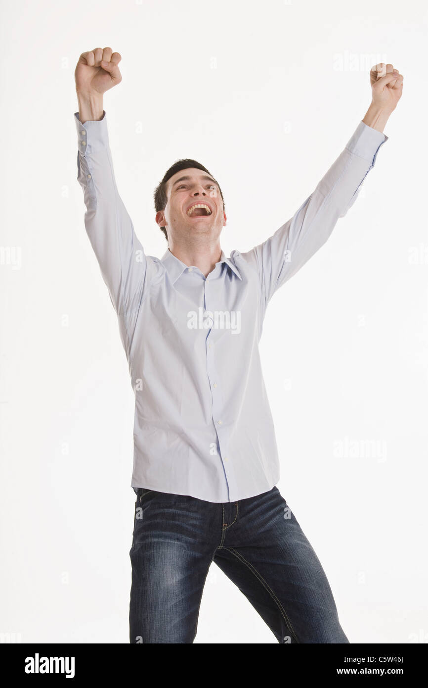 Businessman cheering, portrait Stock Photo - Alamy