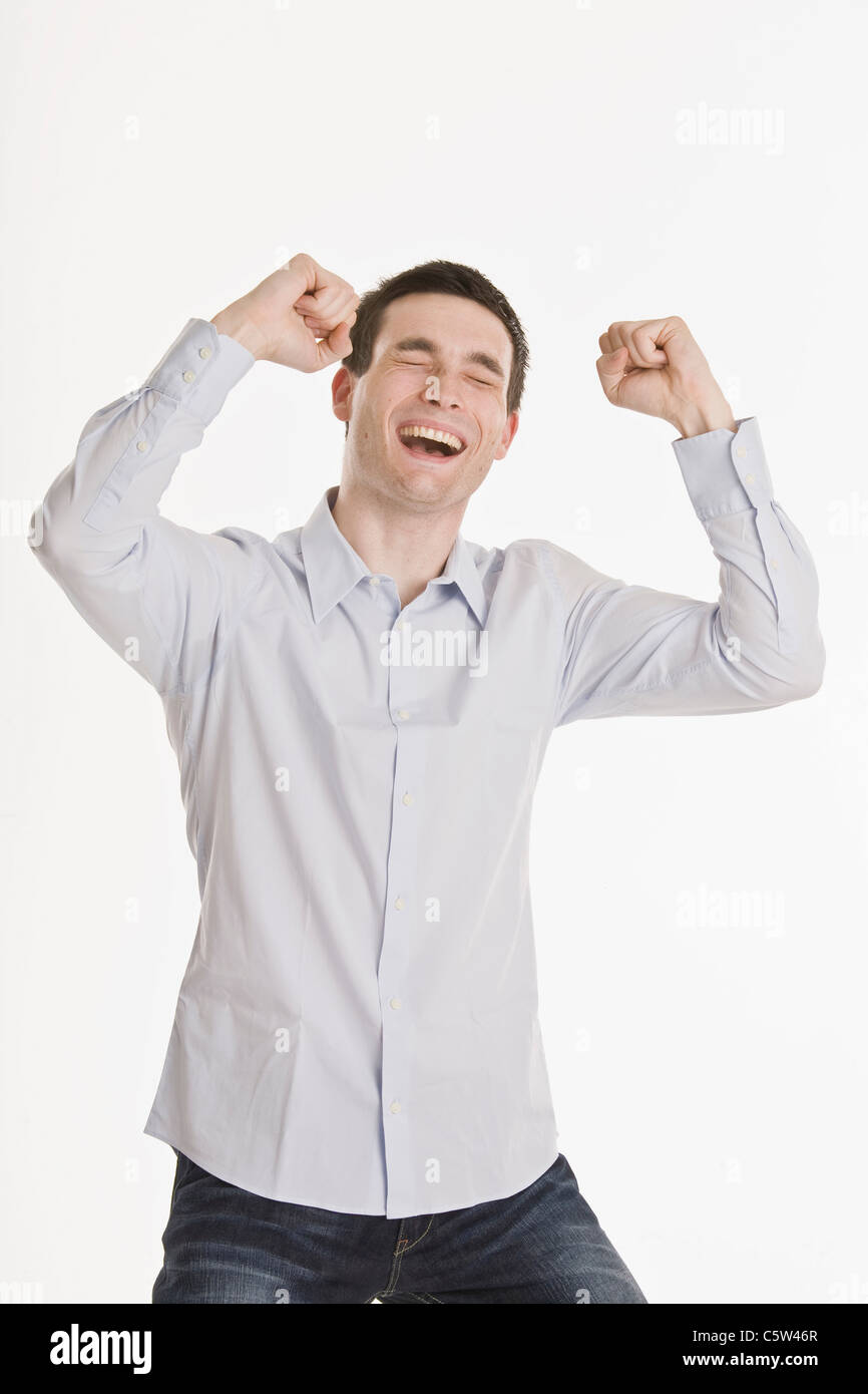 Businessman cheering, portrait Stock Photo - Alamy